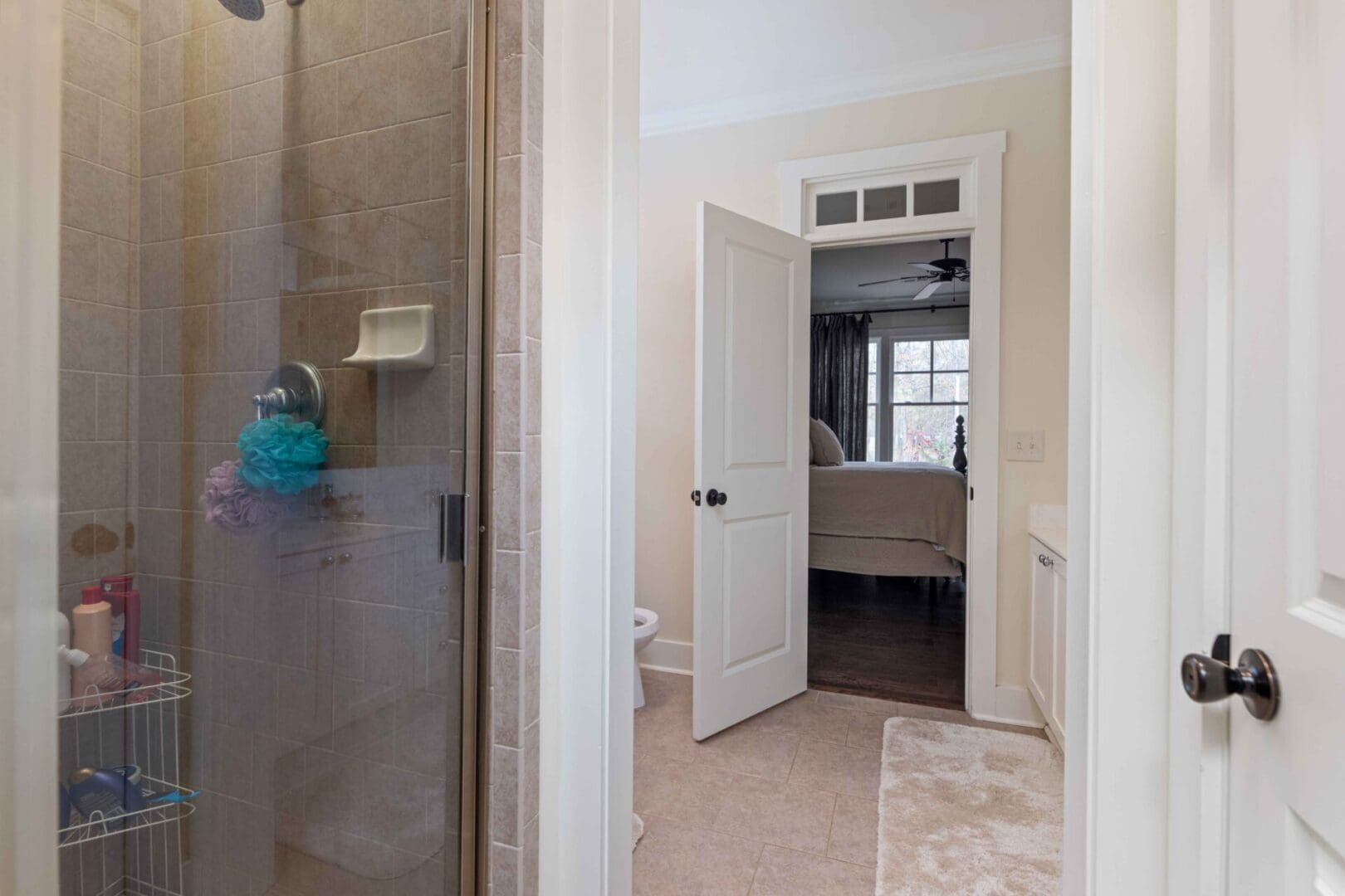 A bathroom with a shower and tiled floor